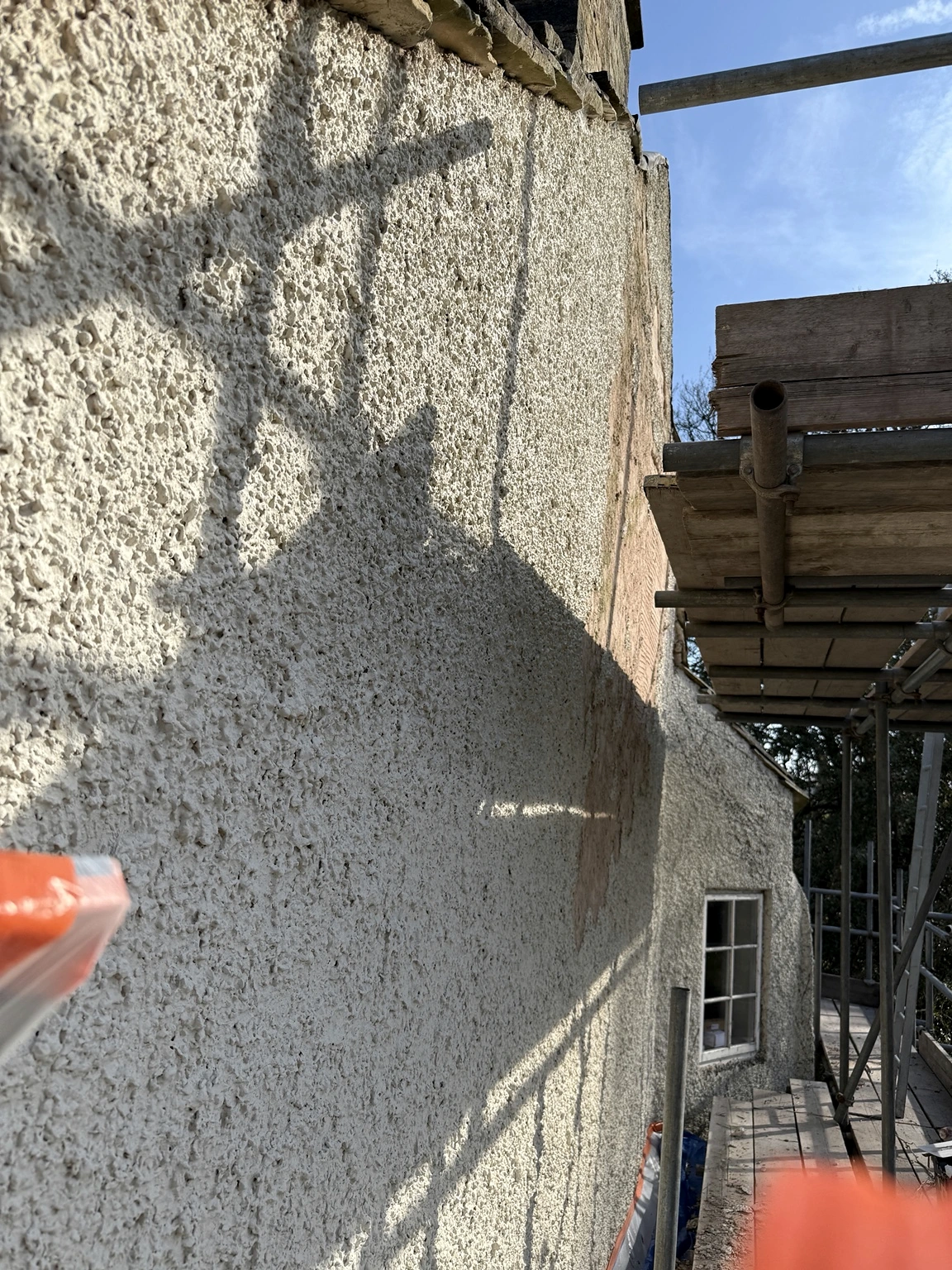 Textured wall surface during our cork render project